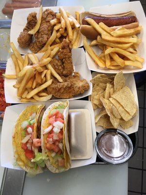 Fish tacos, hotdog, chicken fingers.