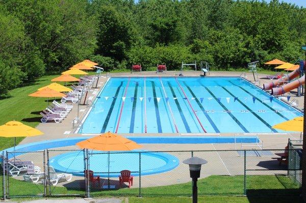 Our outdoor pool, with a baby pool, slide + diving board.