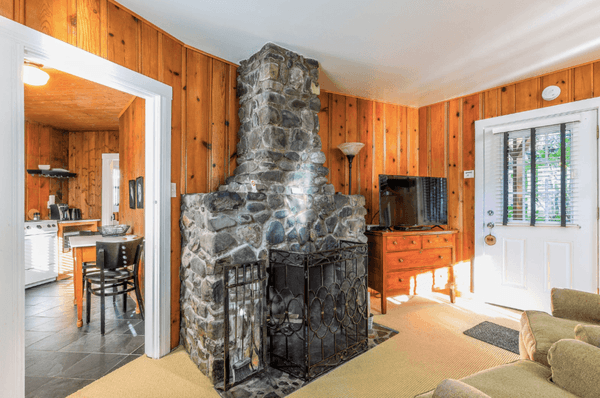 Preserved architectural featured like river rock fireplaces echo the history of the building.