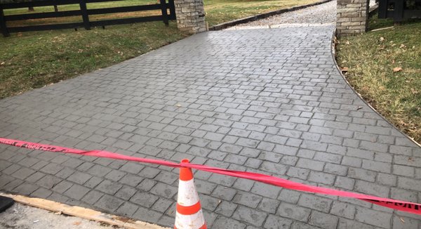 Paver stamped concrete along with driveway