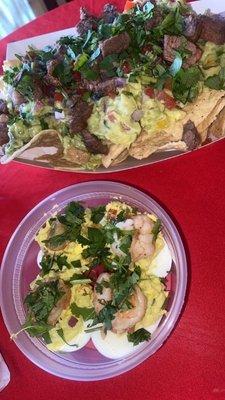 Steak nachos with the works guacamole and guac drops (eggs) with shrimp and Hawaiian guac