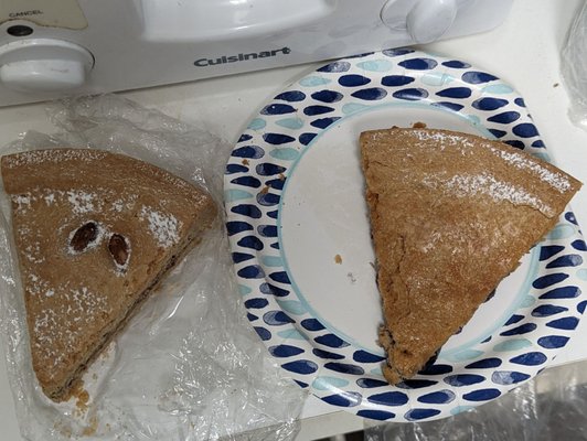 Purchases from Honey Bakery: Slice of Almond Cake. Slide of Blueberry Cake, $3 each