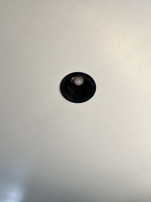 Closer look at recessed ceiling lights trim painted black with ceiling painted white