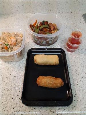 Shrimp Fried Rice, Pork & Shrimp Egg Rolls, Sweet & Sour Sauce and Barbecue Pork with Vegetables.