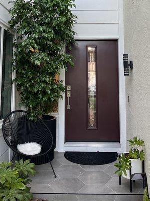 My entryway got a makeover. No more stained concrete porch. We have beautiful tiles instead.