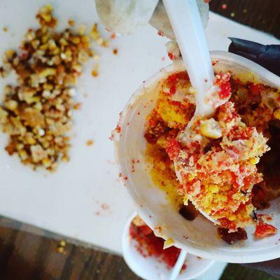 Flamin' Elotes in a Cup w/ Bacon- roasted corn in a cup w/ butter, mayo, parmesan, Flamin' Hot Cheetos and Bacon!