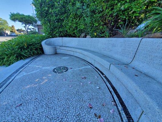 Restored bench and mosaic tile on the ground