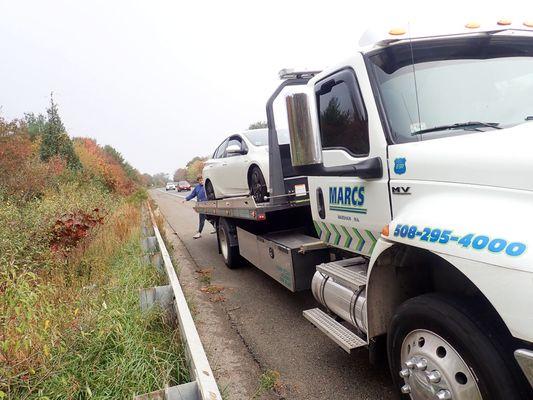 My Prius on Marc's Tire's flatbed on I-195 in Wareham, MA.