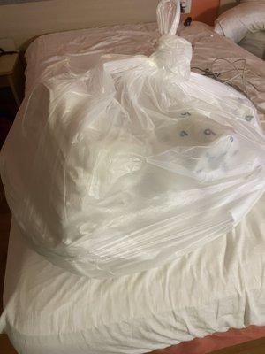 The bag of bedding that I am expected to use to clean my own room.