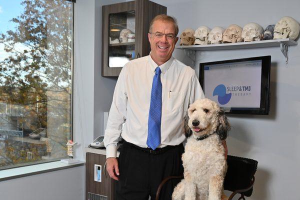 Dr Brown and his dog, Penny sitting for a photo shoot with the Washingtonian.