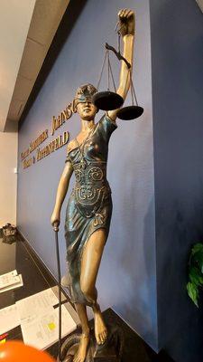 Scales of justice statue at front desk KSJ Kravitz, Schnitzler & Johnson Attorneys Wednesday September 28, 2022