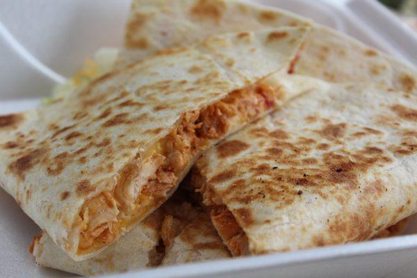 Look at the quesadilla packed with chicken and our blend of cheeses