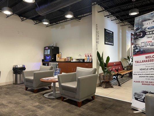 Part of waiting area with Lucky Goat coffee in the machine