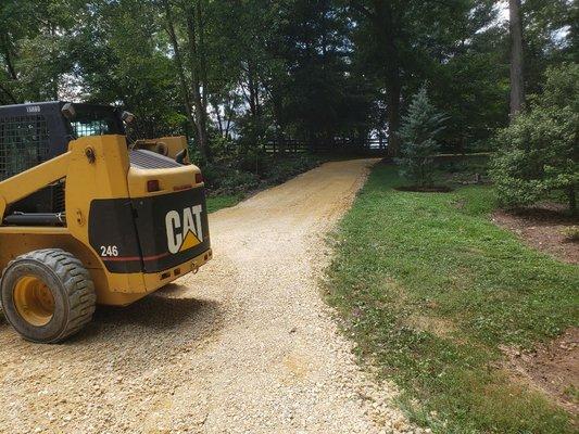 Driveway graded up and restoned