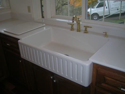 Custom built Farm Style sink.  Seamlessly integrated into the existing countertop after the old sink was removed.