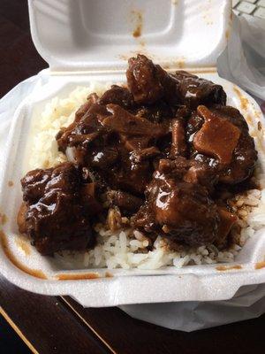 Oxtail stew served on white rice. This is a small size