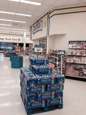 The failed pharmacy department sits in the middle of the produce/deli area with a few shelves pushed in front of it.