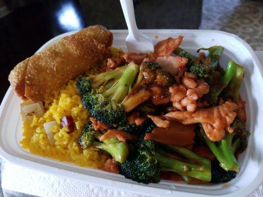 Delicious take out combo - chicken and broccoli with an egg roll.