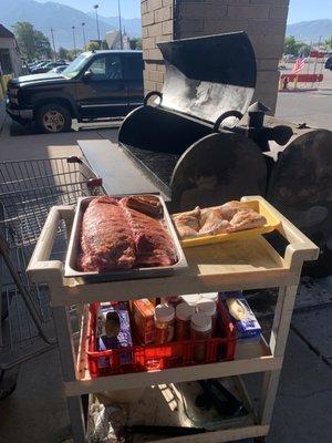 Getting the ribs and chicken on the Traeger smoker.