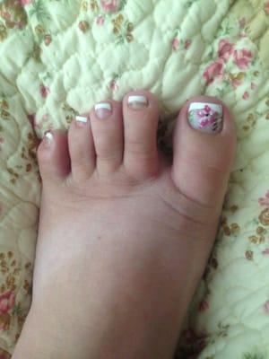 Cute French tip with a design on the toe.