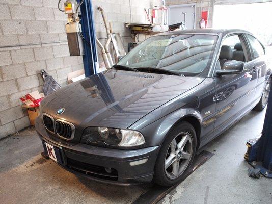 My 15-year-old BMW lowered from the lift after a quick and reasonable repair at Vaughan Motor Works.