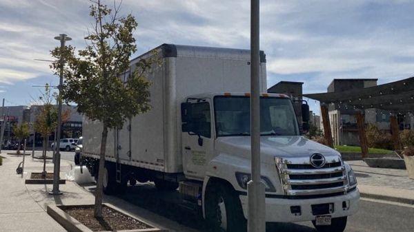 Eden's moving truck parking near my new home in Denver