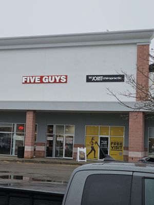 The entrance is right by 5 guys