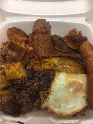 Calentado, the best 8.50 you will ever spend !!!! sizzling skirt steak , chicharrones , maduros , huevo, arroz morado and salchicha !