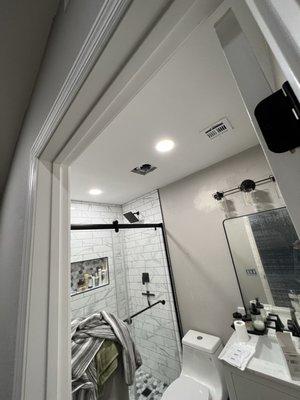 2 recessed lights and vanity light added to bathroom remodel.