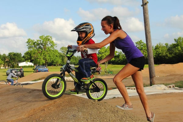 First time BMX'er with a little help from mom.