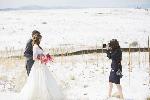 Sarah Porter capturing some post ceremony photos in the snow.