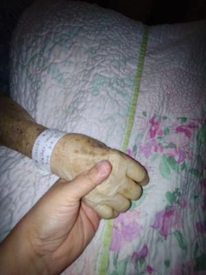 Holding my mother's hand after she had passed.