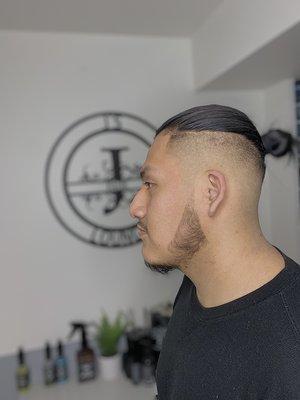 High skin fade with a hair bun