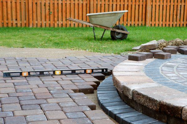 Looking to minimize maintenance while adding value to your back yard? Take a look at our interlocking paver solutions!