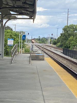 Southbound train arriving, Boca Raton Tri-Rail station (nighttime)