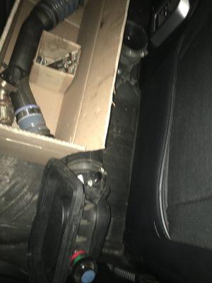 Parts of the engine not put back together, thrown in the back seat.