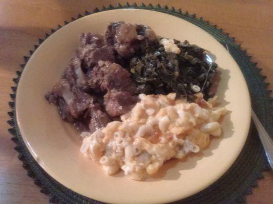 Oxtail, collards with neck bones, and some lip smacking Mac and cheese