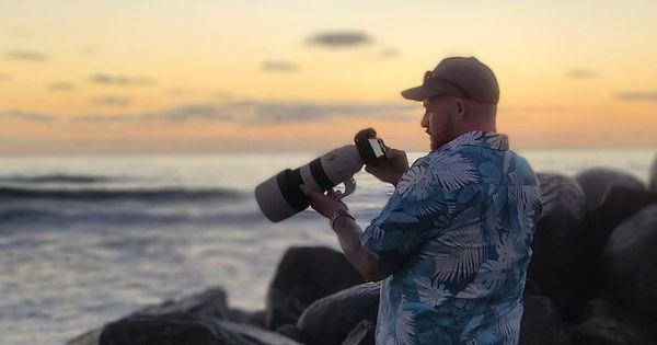 Sam Cox at work doing a couples shoot at sunset.