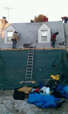 Tarps installed to protect the house from falling debris.