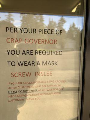 Sign calling the governor a piece of crap and basically telling people not to expect masks to be worn during the height of Covid.