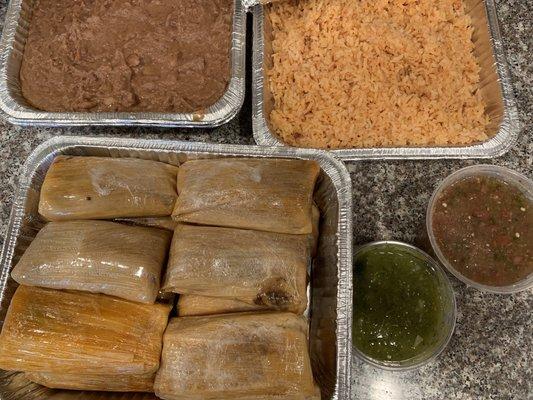 Red pork tamales, frijoles, arroz, salsita verde y rojo. Delicious!