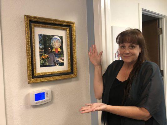 Congrats to Tina. Our Caregiver of the month. Here's your beautiful picture on the wall