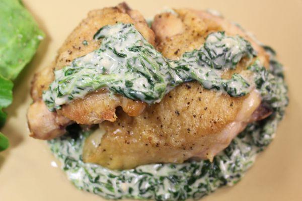 All-natural chicken with creamy garlic spinach sauce