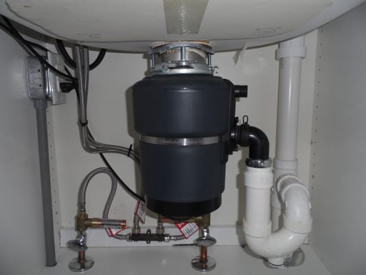 Replacement of a garbage disposal with a very quiet Evolution Essential 3/4 HP garbage disposal.