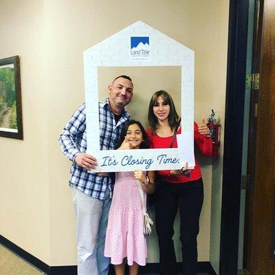 Happy family at new home closing.