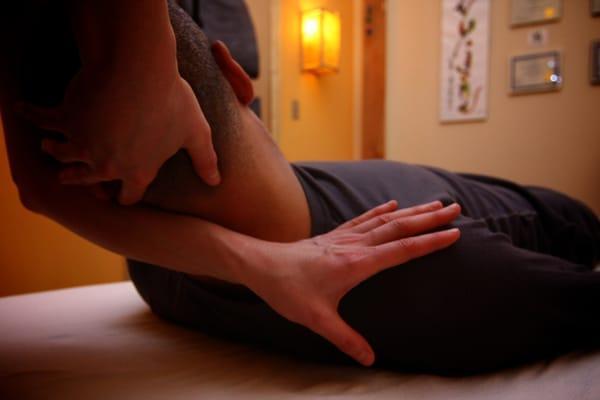 A client receives gentle stretching techniques during shiatsu.