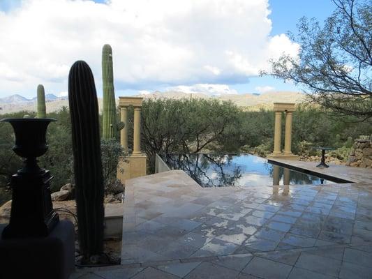 Antiquity villa pool with infinite edge and full decking, with a spectacular view