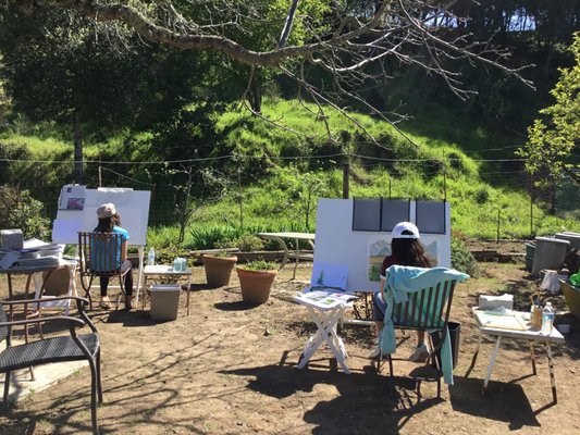 Painting in the Garden during Covid shut down. Classes of 5 students now work under patio umbrellas with a view of Uvas Lake.