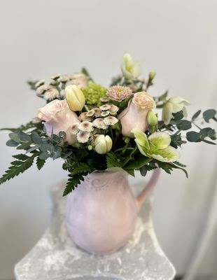 Stunning Blush Garden flower arrangement. Delicately arranged blush pink and white flowers in a charming ceramic water pitcher.