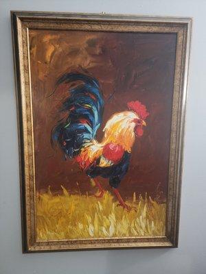 One of the many pictures or paintings of chickens in this place.